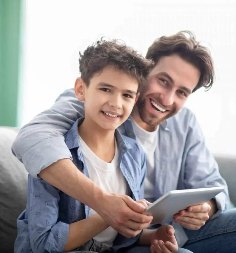 family-time-happy-dad-and-son-using-digital-tablet-browsing-internet-online-at-home-sitting-e1632233068896-qnbarmh7vwe9bm6t1gidtazcmmbhkxgqnc8nw5a734